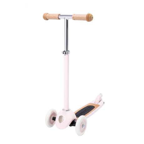 A charming retro-style kids' scooter in pastel pink, featuring three wheels for balance and adjustable handlebar.