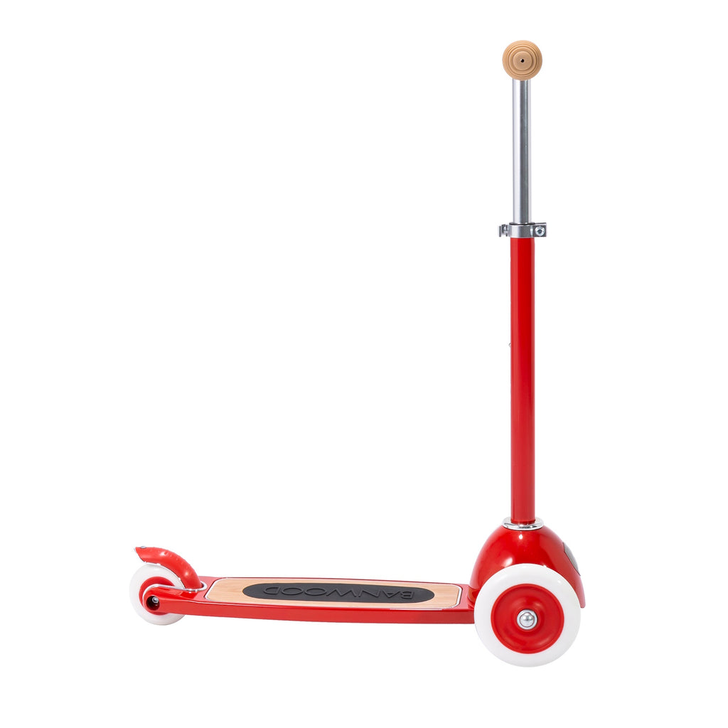 A retro-inspired kids' scooter with a bright red frame, three wheels for stability and adjustable T-handlebar.