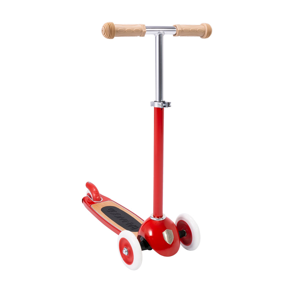 A retro-inspired kids' scooter with a bright red frame, three wheels for stability and adjustable T-handlebar.