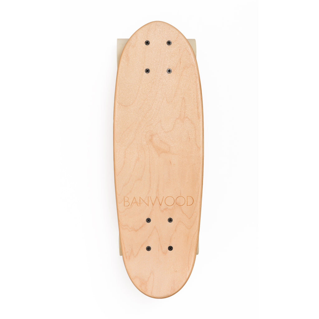 A minimalist cruiser skateboard with a natural wood finish, soft wheels, and a classic design, perfect for young riders and smooth cruising.