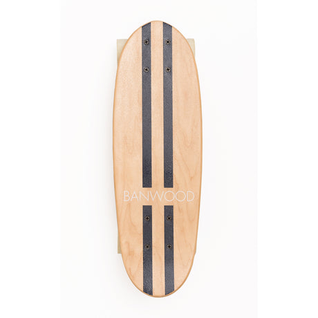 A retro-style cruiser skateboard with a navy blue deck, soft wheels, and a maple wood finish, designed for young riders to enjoy smooth, stylish cruising.