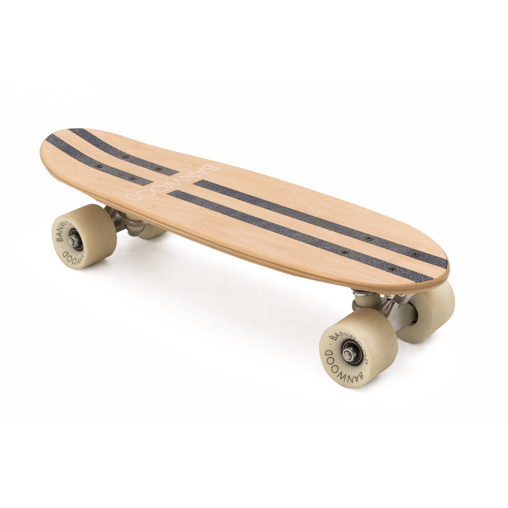 A retro-style cruiser skateboard with a navy blue deck, soft wheels, and a maple wood finish, designed for young riders to enjoy smooth, stylish cruising.