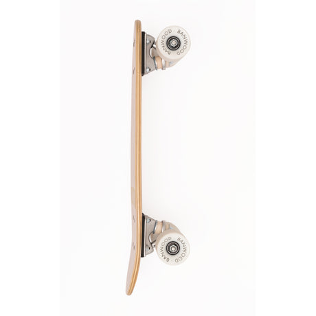A vintage-inspired cruiser skateboard featuring a pastel pink deck, soft wheels, and a durable maple wood finish, perfect for young beginners.