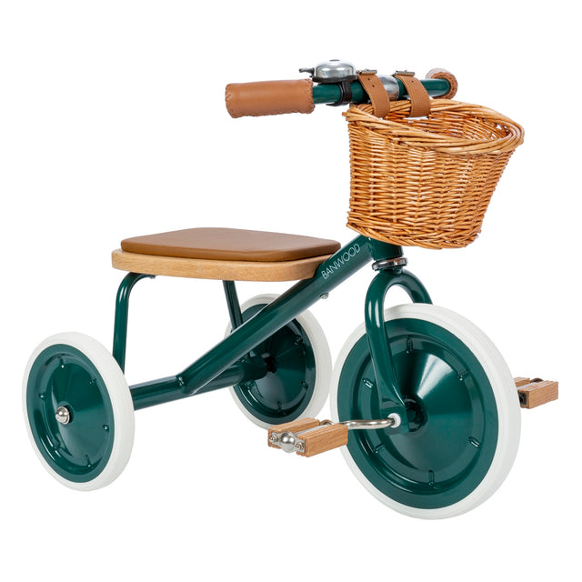 Banwood dark green vintage-style tricycle with a wicker front basket and brown leather seat.