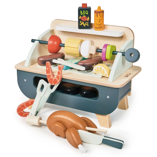 Wooden toy barbecue play set with grill, skewer, rotisserie chicken, tongs, and play food accessories.