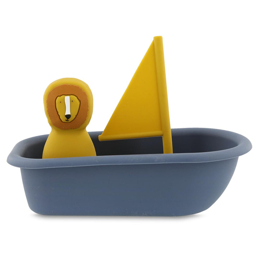 A toy blue sailboat with a yellow lion figure and a matching yellow sail. The design is simple and playful, evoking a sense of whimsy.