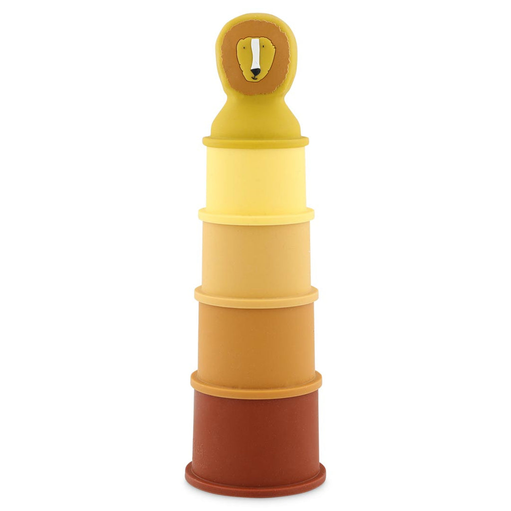 Stacked toy cups in varying shades from dark brown to yellow, with a lion's head on top. The setup suggests playful and educational use.