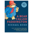 Illustration of Paddington Bear in a blue coat, red hat, and scarf, holding a suitcase and marmalade. Text reads "A Bear Called Paddington" by Michael Bond.