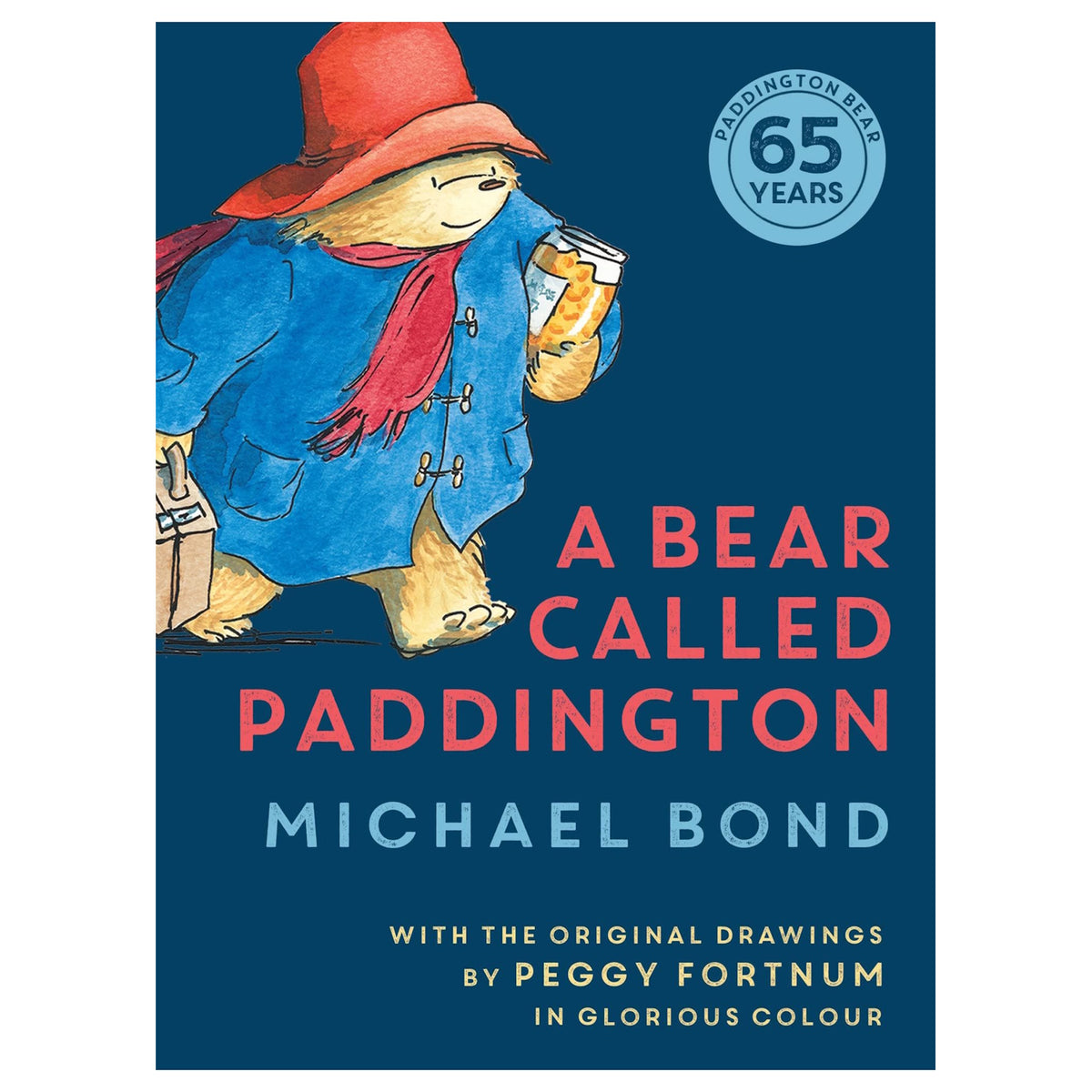 Illustration of Paddington Bear in a blue coat, red hat, and scarf, holding a suitcase and marmalade. Text reads "A Bear Called Paddington" by Michael Bond.