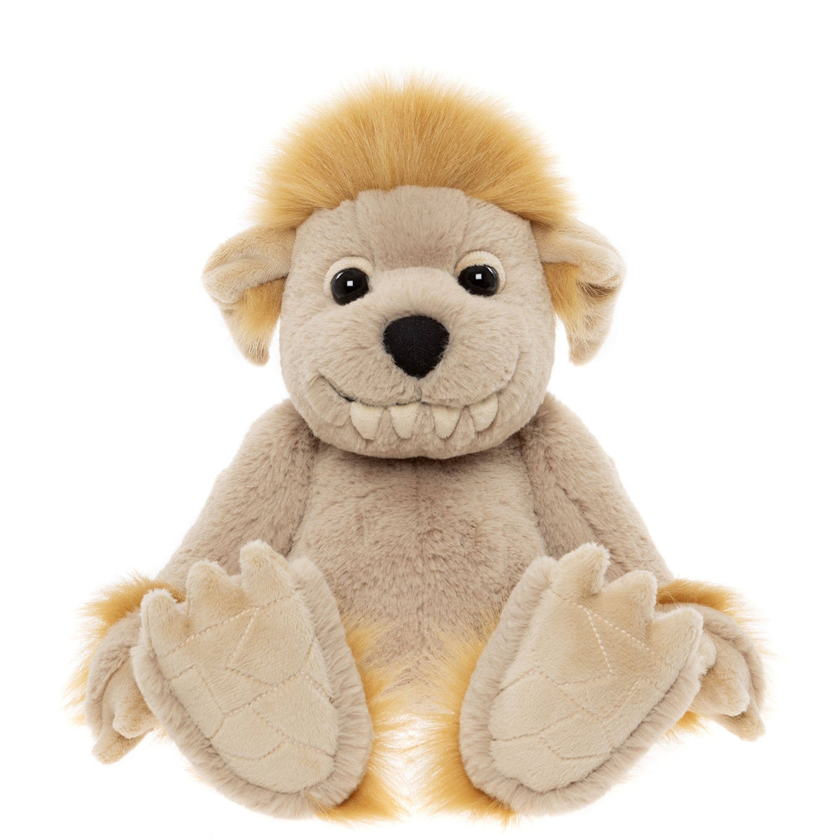 Front view of a sitting beige plush creature toy with fluffy yellow hair, floppy ears, and a toothy smile.
