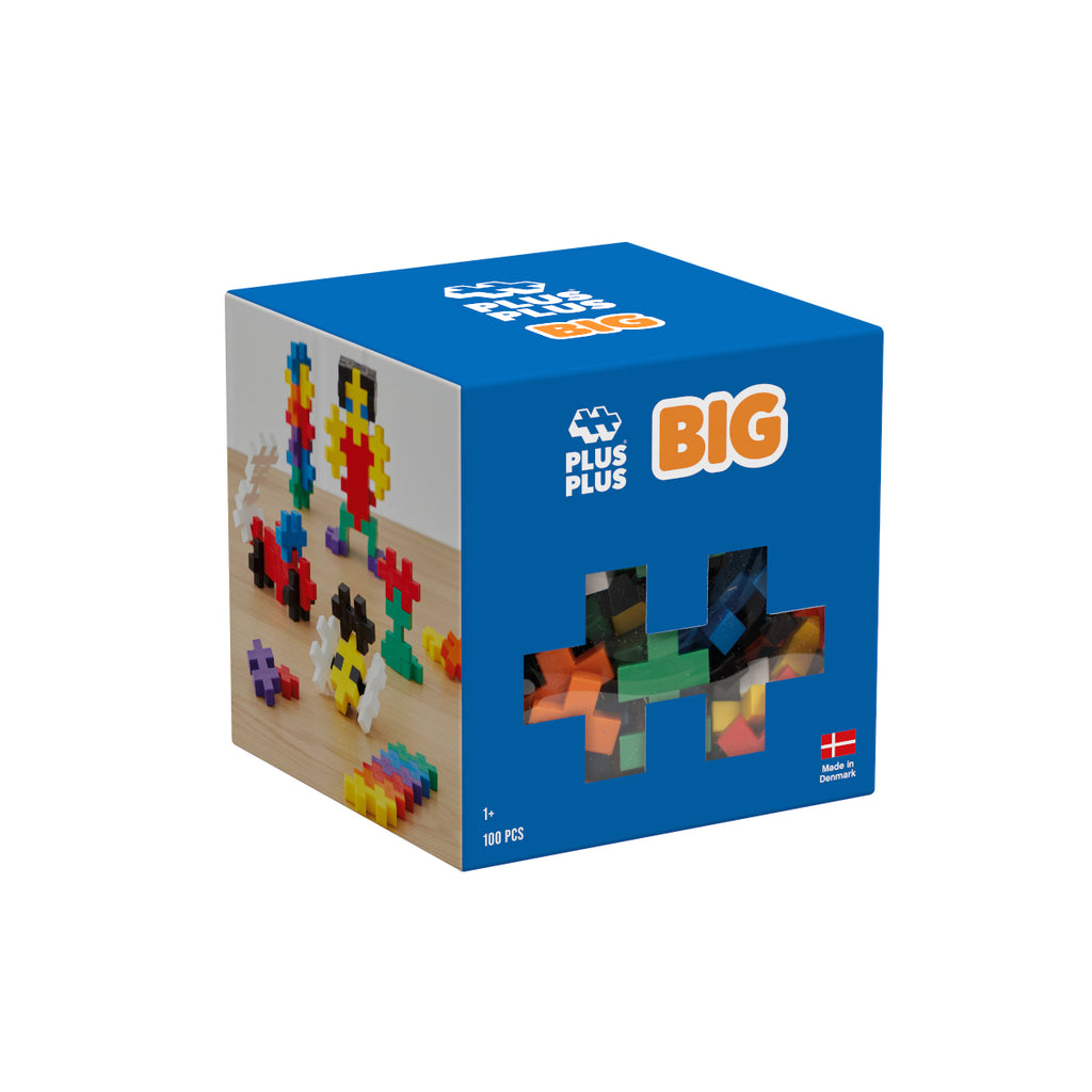 A blue box of Plus-Plus BIG Basic set, featuring images of built models and a clear window showing the pieces inside.