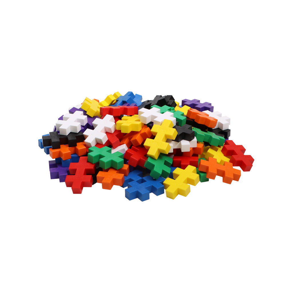 A scattered pile of Plus-Plus BIG Basic pieces in vibrant colours, ready for creative construction.