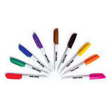 Nine markers with white barrels and colorful caps arranged in a fan shape against a white background.