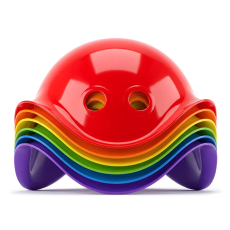 A vibrant, symmetrical stack of multi-colored, arched plastic toy shells resembling a stylized Bilibo.