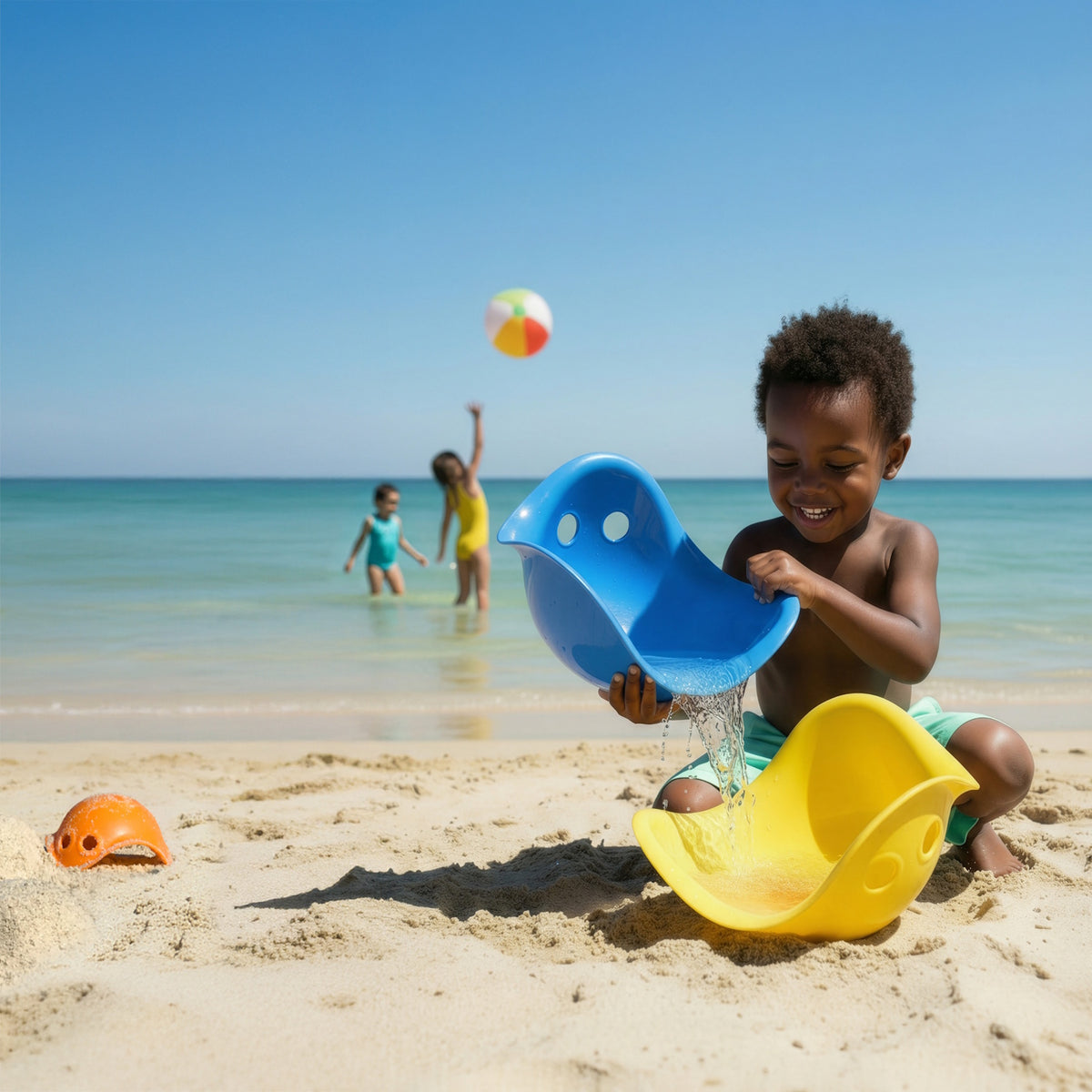 Child playing with blue and yellow Bilibi Mini toys on a sunny beach, pouring water with other children in the background.