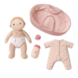 Dinkum Doll Moppet set with plush baby doll, floral onesie, diaper, bottle, pacifier, and pink bassinet.