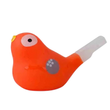 Bright orange bird-shaped whistle with a wide beak, white eye, and small wing detail. It has a white mouthpiece, set against a white background.