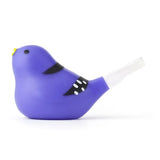 A whimsical purple bird-shaped whistle with black markings and a yellow beak. Its tail extends to a clear mouthpiece, creating a playful tone.