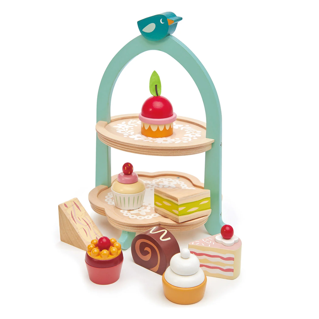 A charming wooden play set featuring a two-tiered stand with bird details, complete with toy cakes and treats for pretend tea parties.