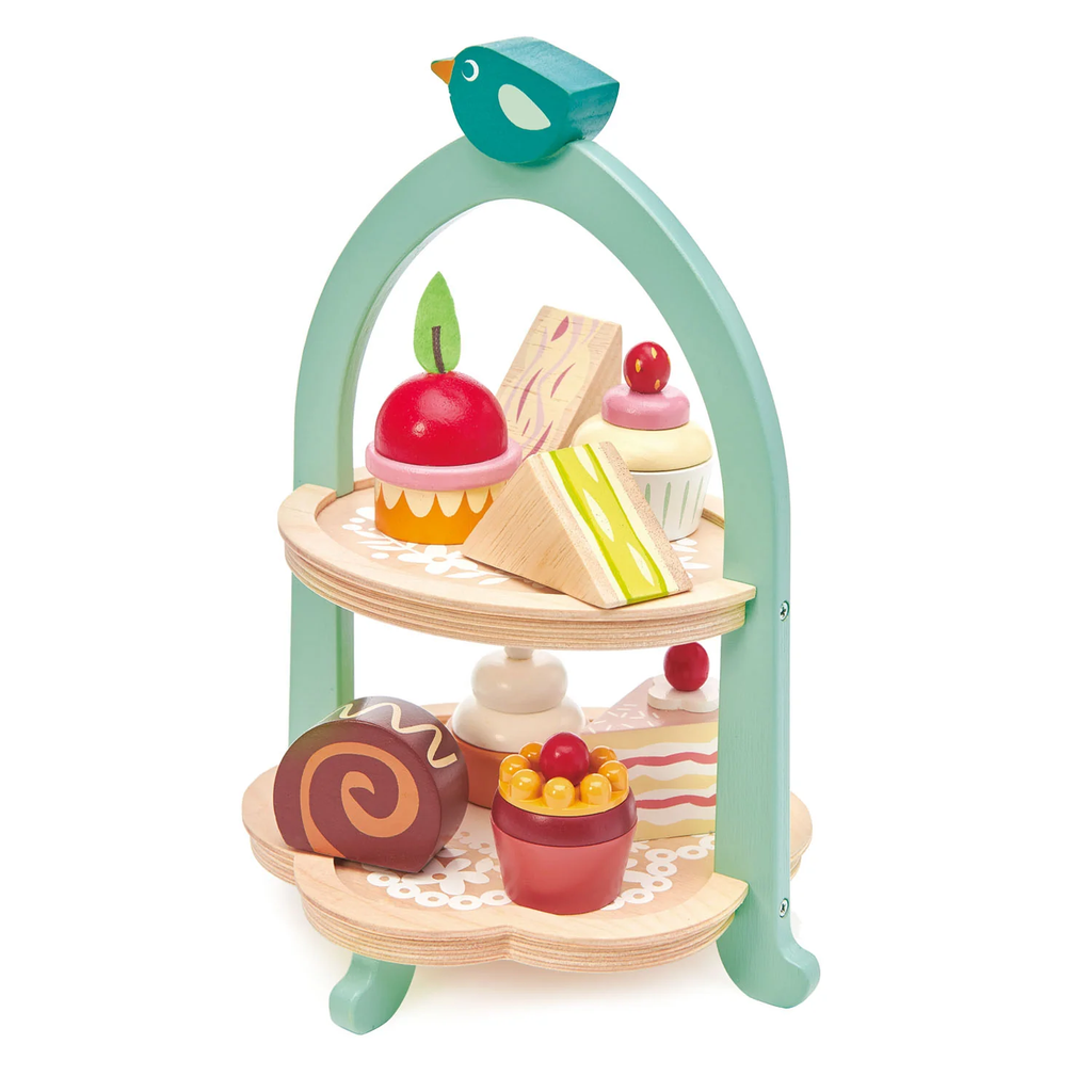 A charming wooden play set featuring a two-tiered stand with bird details, complete with toy cakes and treats for pretend tea parties.