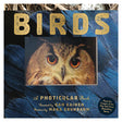 Front cover of Birds: A Photicular Book featuring a close-up of an owl's face with striking orange eyes on blue feathers.