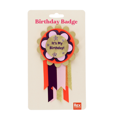 "It's My Birthday!" rosette badge with ribbons packaged on a cream Rex London display card.