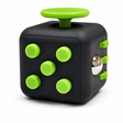 Front view of the black plastic multi-sensory fidget cube with green buttons and a metal rolling ball.