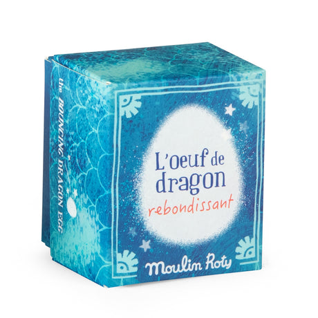 Moulin Roty blue bouncy dragon egg toy packaging box with dragon scale details.