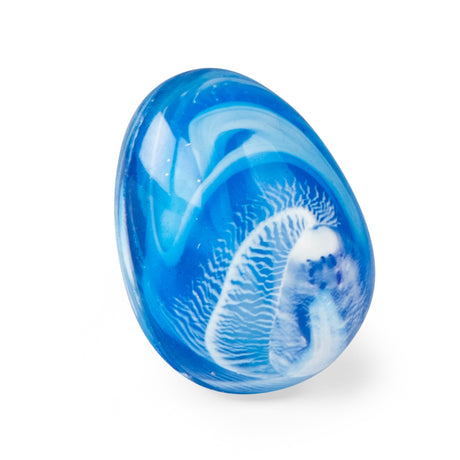 Blue marbled Moulin Roty bouncing dragon egg toy on a white background.