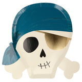 A pirate skull-shaped paper plate wearing a blue bandana and a gold eye patch.