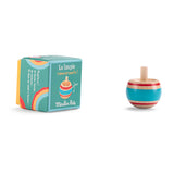 Moulin Roty blue wooden spinning top with red stripes next to its illustrated green packaging box.