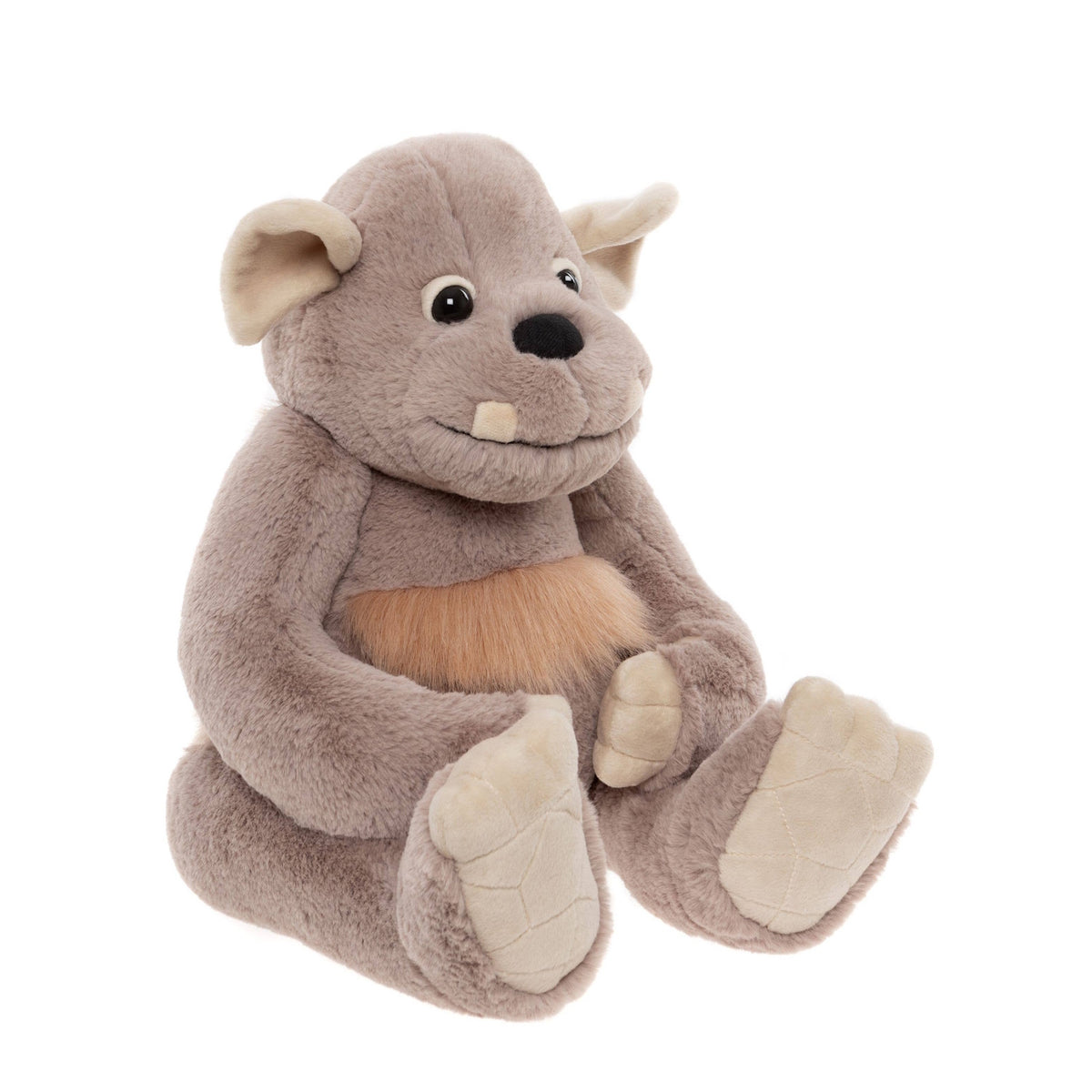 Soft grey plush monster toy sitting down with large padded feet, floppy ears, and a small single tooth protruding.