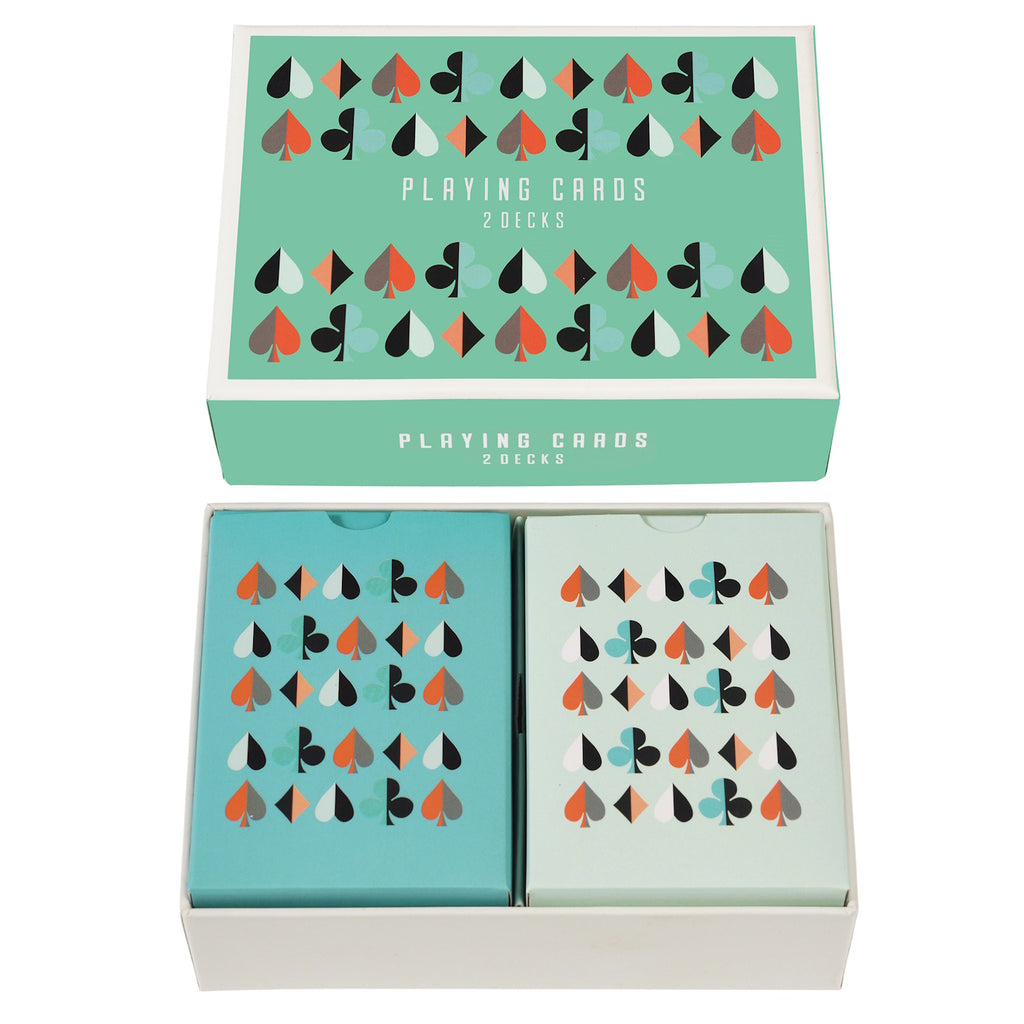 A stylish box containing two decks of playing cards, featuring colorful spades and diamonds patterns on a mint green background.