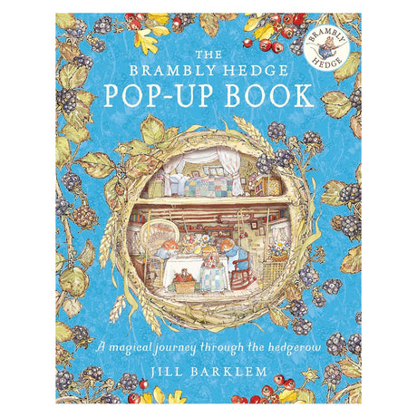 Cover of "The Brambly Hedge Pop-Up Book" by Jill Barklem, featuring mice in a cozy, detailed treehouse.