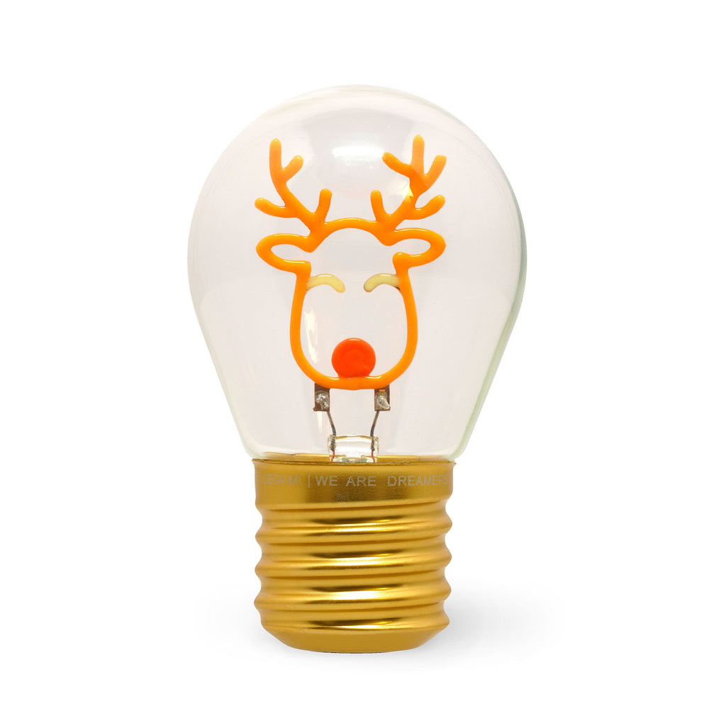 A light bulb with a gold base, featuring an orange outline of a reindeer's face inside. The design is simple, playful, and festive.