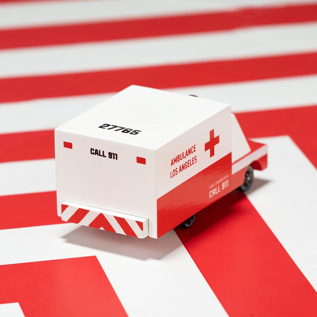 A wooden Candylab toy ambulance with red and white livery, featuring "Ambulance Los Angeles" and "Call 911" text.