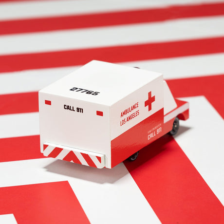 A wooden Candylab toy ambulance with red and white livery, featuring "Ambulance Los Angeles" and "Call 911" text.