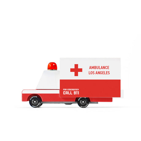 Wooden toy ambulance by Candylab Toys with a red and white design, siren light, and "Ambulance Los Angeles" text.