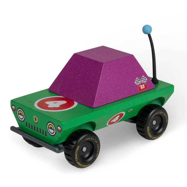 Colorful wooden toy truck with green body, purple cabin, and number 4 racing decals on chunky all-terrain tires.