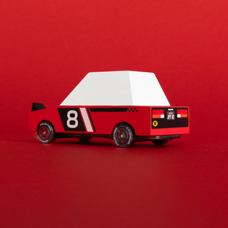 Rear view of a red and white Candylab Hachigo Red Racer wooden toy car with the number 8 and racing details.