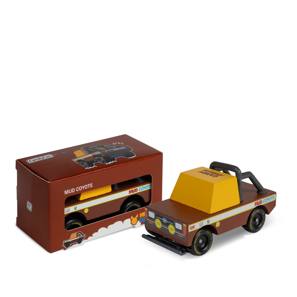 Candylab Mud Coyote wooden toy truck next to its original brown packaging box, featuring a retro off-road design.