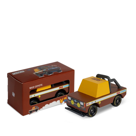 Candylab Mud Coyote wooden toy truck next to its original brown packaging box, featuring a retro off-road design.