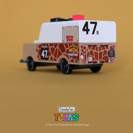 Wooden toy truck with giraffe print and racing decals from the CandyCar TOONS collection by Candylab Toys.