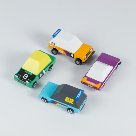 Four stylized, colorful wooden toy race cars from Candylab's Candycar line arranged on a neutral background.