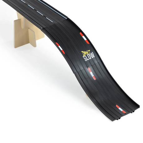 A close-up of a black Candylab Roadworks bridge ramp with "DON'T SLOW" text and red and white racing stripes.