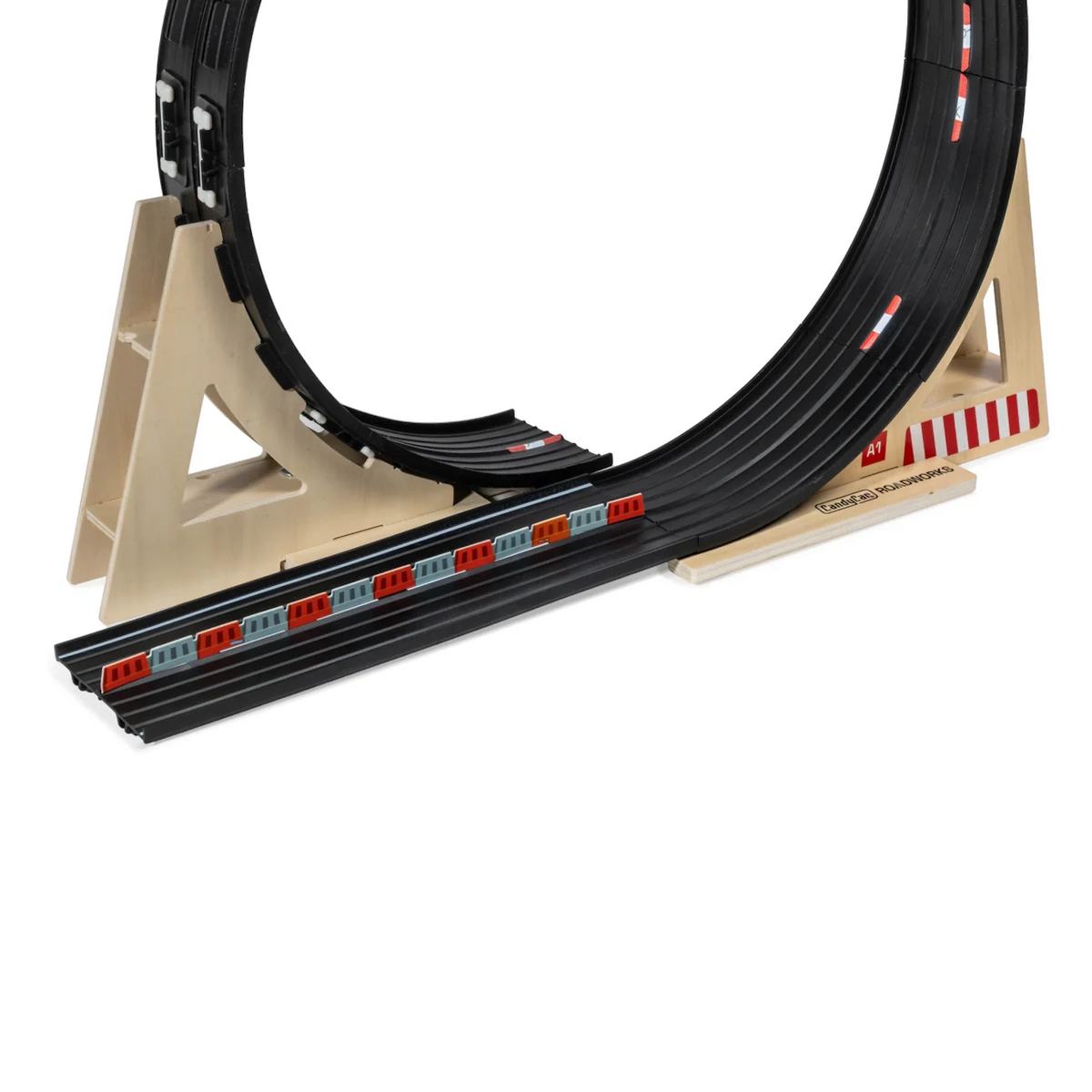 Close-up of a Candylab Roadworks Loop Add-on Kit featuring a black flexible track and wooden support stands.