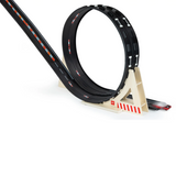 Candylab Roadworks Loop Add-on Kit with wooden supports, a black flexible track, and a red toy car racing through.