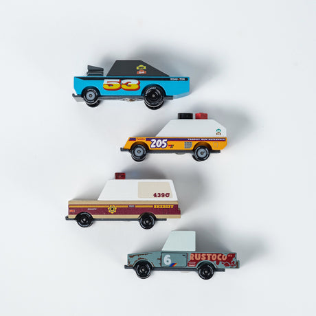 Four stylized wooden toy cars by Candylab stacked vertically against a white background, featuring a vintage aesthetic.