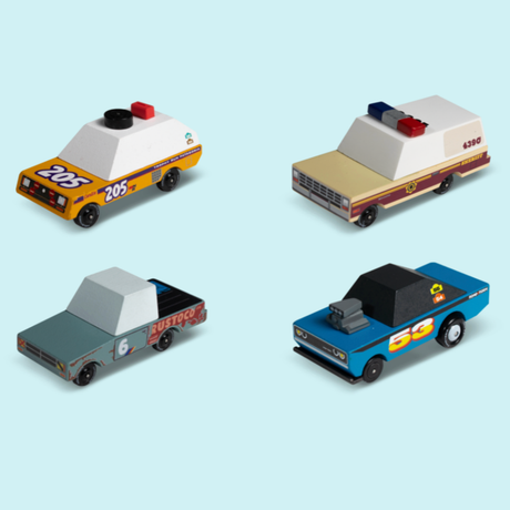 Four Candylab Toons wooden toy cars including a police cruiser, sheriff truck, rusted pickup, and blue muscle car.