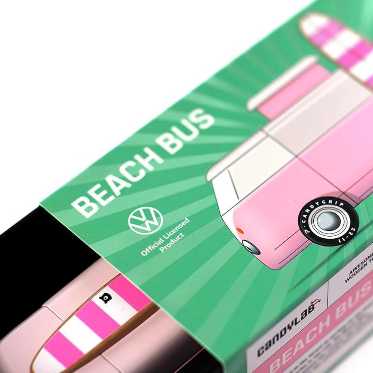 Candylab pink wooden Beach Bus toy inside its green Volkswagen officially licensed product packaging.